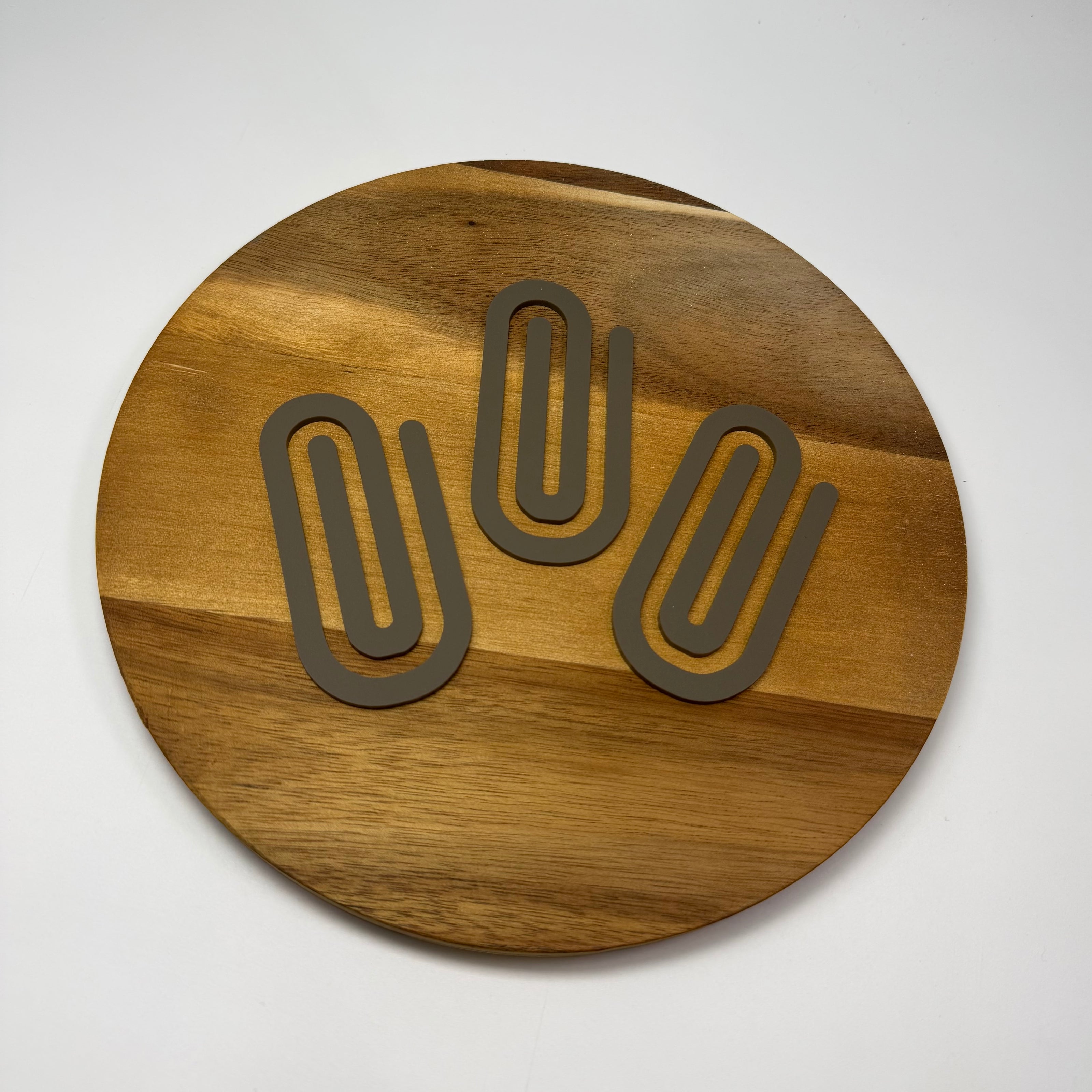 Acrylic oversized paperclip.